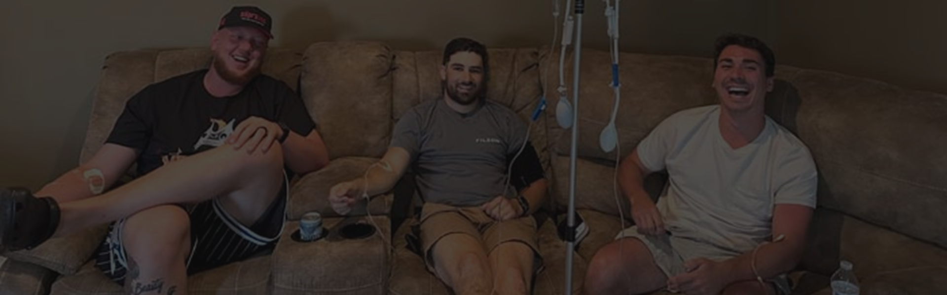 Three men receiving IV therapy from Vivid Hydration.